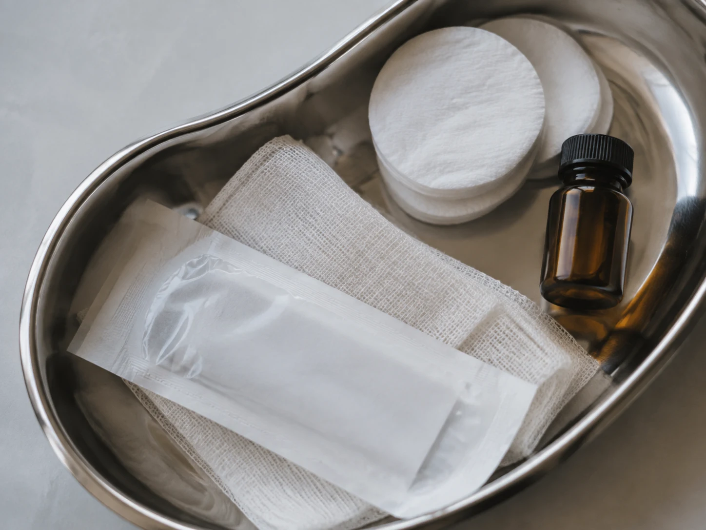 Carefully arranged clinical supplies on a polished steel tray